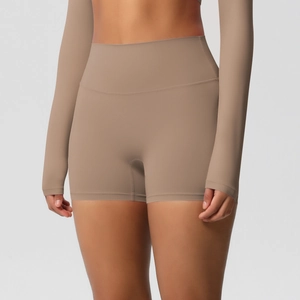 Detail showing the seamless high waist design and brown elastic fabric of yoga shorts