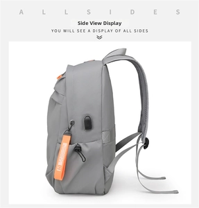 Detail view of large capacity travel backpack with side USB port and orange webbing