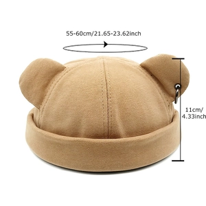 Khaki beanie with bear ears and metal ring detail, showing size and dimensions
