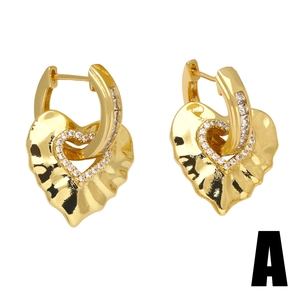 Elegant gold heart earrings with sparkling zircons and a textured crumpled metal finish