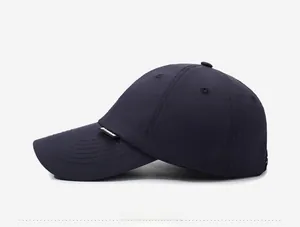 Detail view of navy blue quick-dry running cap featuring side embroidery and breathable holes