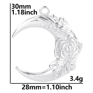 Silver crescent moon pendant with embossed rose and leaf patterns on a white background