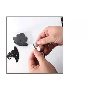 Step 1: Guide showing how to thread the string through the black witch hat paper cutout