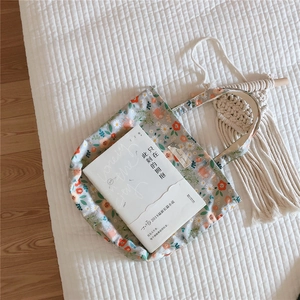 Close-up of floral cotton tote bag with vintage flower patterns and animal patterns label