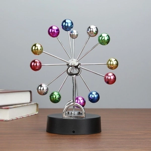 Detailed macro of a colorful kinetic ferris wheel sculpture with a black base stand