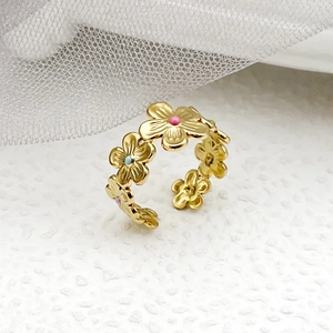 Golden flower open ring with colorful enamel petals for women on soft white background