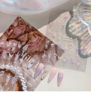 Macro detail of laser butterfly nail stickers with vintage floral motifs and pearls
