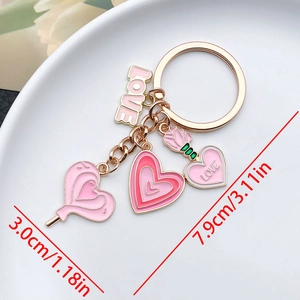 Pink heart keychain with LOVE pendant and flower charms showing 7.9cm product dimensions