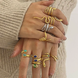 Stackable snake rings in gold and silver finish with turquoise and sapphire accents