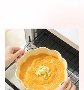 Detailed view of heat-resistant ceramic petal bowl with soup in the oven or microwave