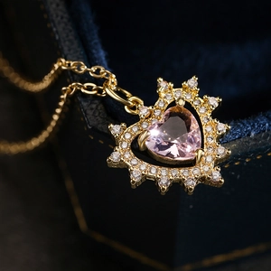 Elegant gold heart pendant necklace with pink zircon in a velvet jewelry gift box