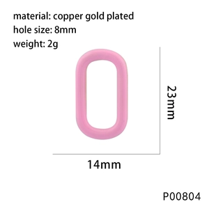 Detail view of pink oval copper charm showing 23x14mm size and 8mm hole diameter