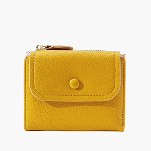 Minimalist yellow pebble grain short wallet for women featuring a snap closure and zipper