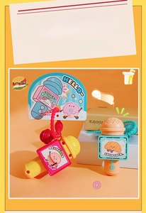 Detail of cute toy microphone with recording buttons and food charms on warm background
