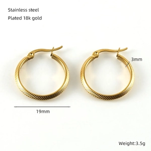 Detail showing 19mm gold plated stainless steel spiral hoop earrings with dimensions