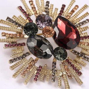 Baroque sunburst brooch with colorful crystals and rhinestones in gold plating