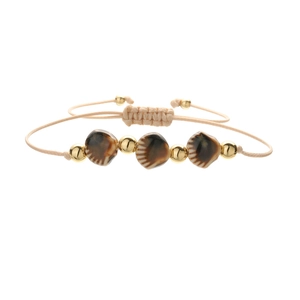 Handmade bohemian watermelon bead bracelet with woven cord and adjustable gold accents