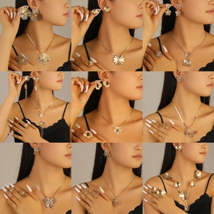 Luxury floral jewelry set with necklaces and earrings in gold and silver finish