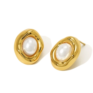 Detailed macro view of 18K gold-plated irregular oval stud earrings with white pearl inlay