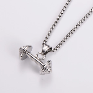 Close-up of polished stainless steel dumbbell pendant on a durable silver box chain