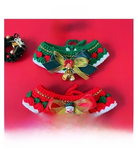 Detail of handmade crochet Christmas pet collars with snowman and golden bell charms