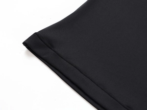 Close-up of high-elastic black knit fabric with professional double-needle stitching detail