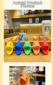 Detailed close-up of colorful shark keychain charms with silicone straps and gold rings
