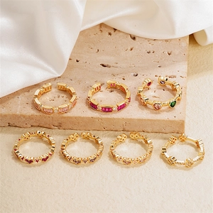 Elegant 7-piece set of gold-plated copper rings featuring colorful zircon insets