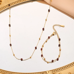 Parure collier et bracelet vintage avec perles dorées et pierres rondes rouge grenat