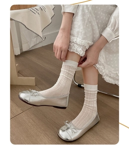 Silver metallic ballet flats with bow detail paired with white lace slouch socks