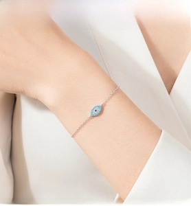 Detail of S925 silver Evil Eye bracelet featuring blue and white micro-pave crystals