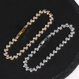 Close-up of gold and silver plated bracelets featuring marquise-cut cubic zirconia stones