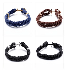 Detail showing four nautical braided rope bracelets with anchor clasps in various metal finishes