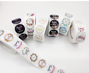 Detailed view of floral Thank You adhesive labels for small business packaging