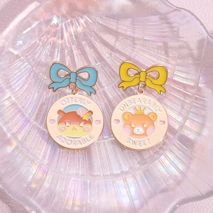 Cartoon animal enamel pins with bow designs and sweet puns on colorful shell background