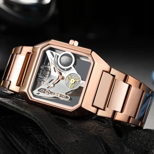 Close-up of rose gold square skeleton mechanical watch with stainless steel bracelet