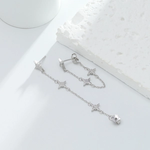 Macro detail of S925 sterling silver star fringe earrings with clear hallmark engraving