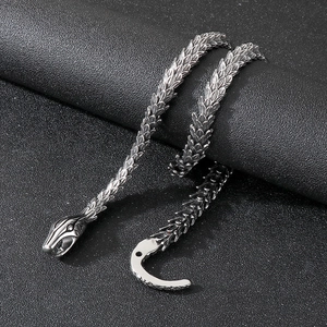 Macro detail of gothic snake scale texture and vintage steel hook clasp on necklace