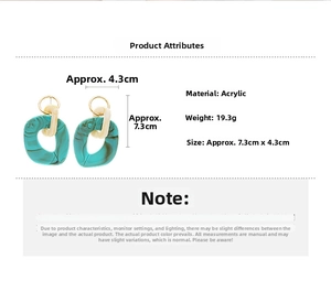 Detail view of large green marble acrylic earrings with size and weight measurements