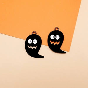 Detail shot of two black enamel ghost charms for Halloween DIY jewelry making