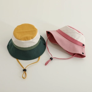 Detail of kids bucket hats with adjustable chin straps and breathable canvas fabric
