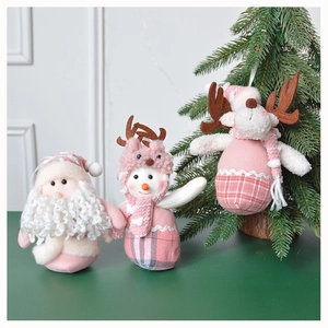 Close-up of pink and white plush Christmas ornaments featuring Santa Claus, Snowman and Reindeer
