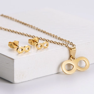 Golden infinity jewelry set featuring necklace and stud earrings on geometric base