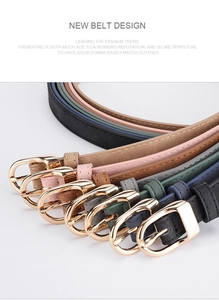 Detail showing various colors of slim PU leather belts with golden D-shaped buckles