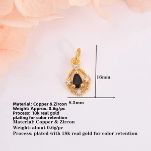 Macro detail of a 16mm gold plated water drop pendant with black zircon and filigree