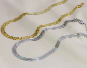 Detailed macro view of 8mm flat metal mesh weave choker necklaces in gold and silver