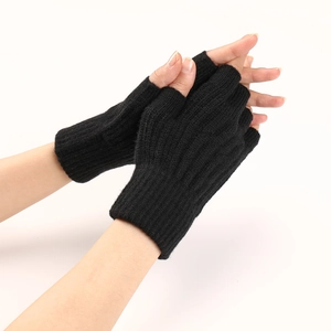 Detail view of black cable knit fingerless gloves with ribbed texture for winter warmth