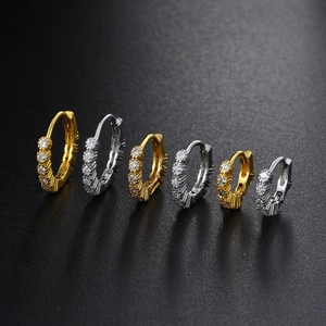 Three pairs of gold and silver geometric hoop earrings with sparkling cubic zirconia stones