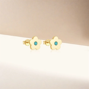 Close-up of S925 sterling silver flower stud earrings with turquoise blue stones