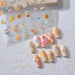 Detail of sweet dessert nail art stickers with cupcakes and donuts on false nails